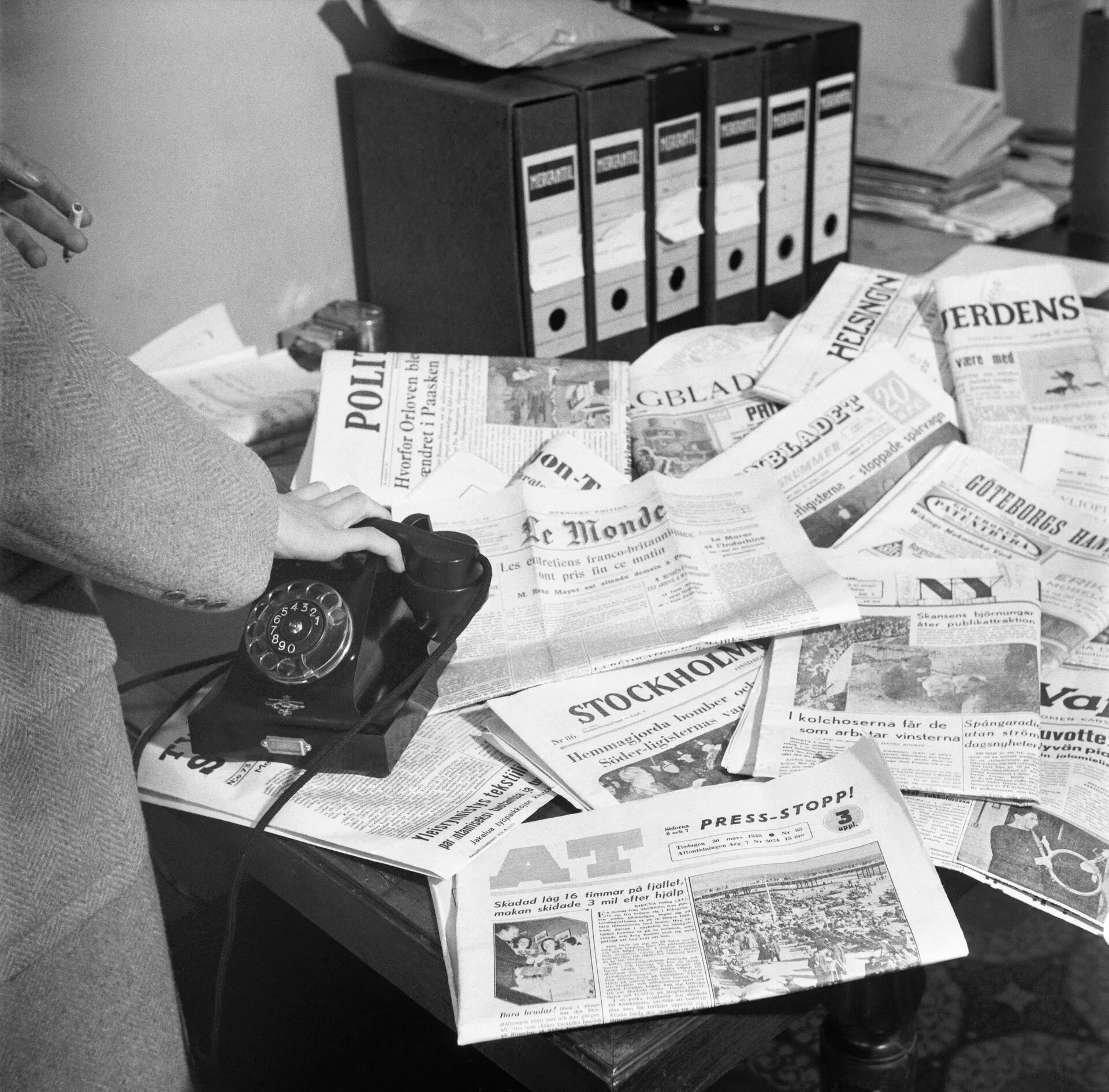 A newspaper newsroom with desks and editorial equipment