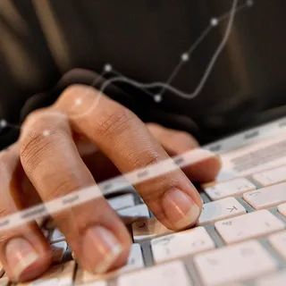 A laptop showing digital analytics and social media work