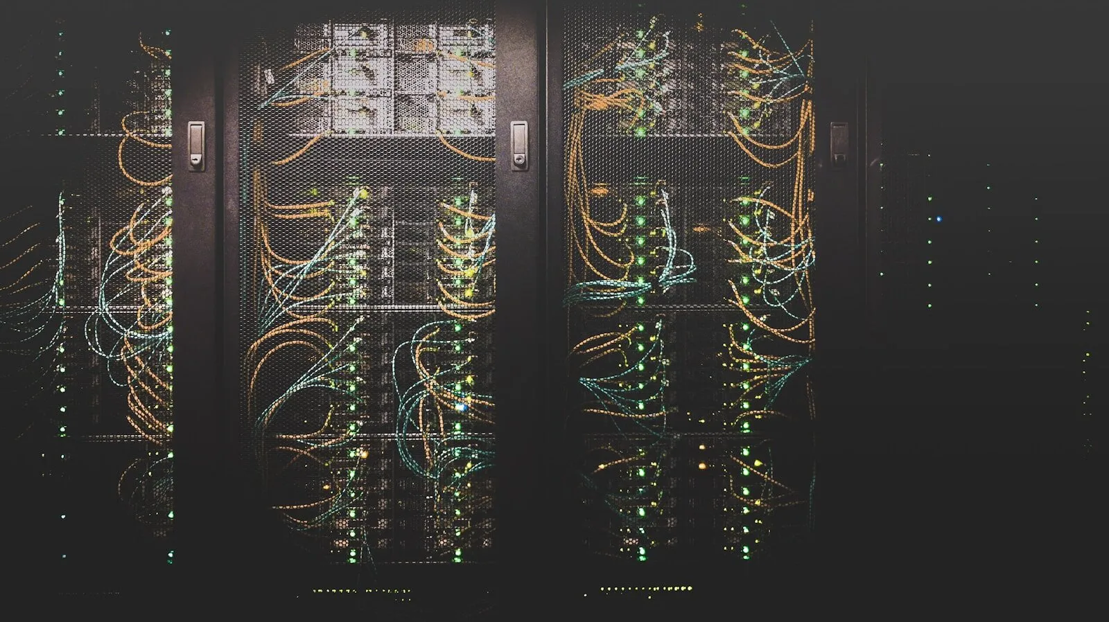 Network cables glowing inside a data center rack