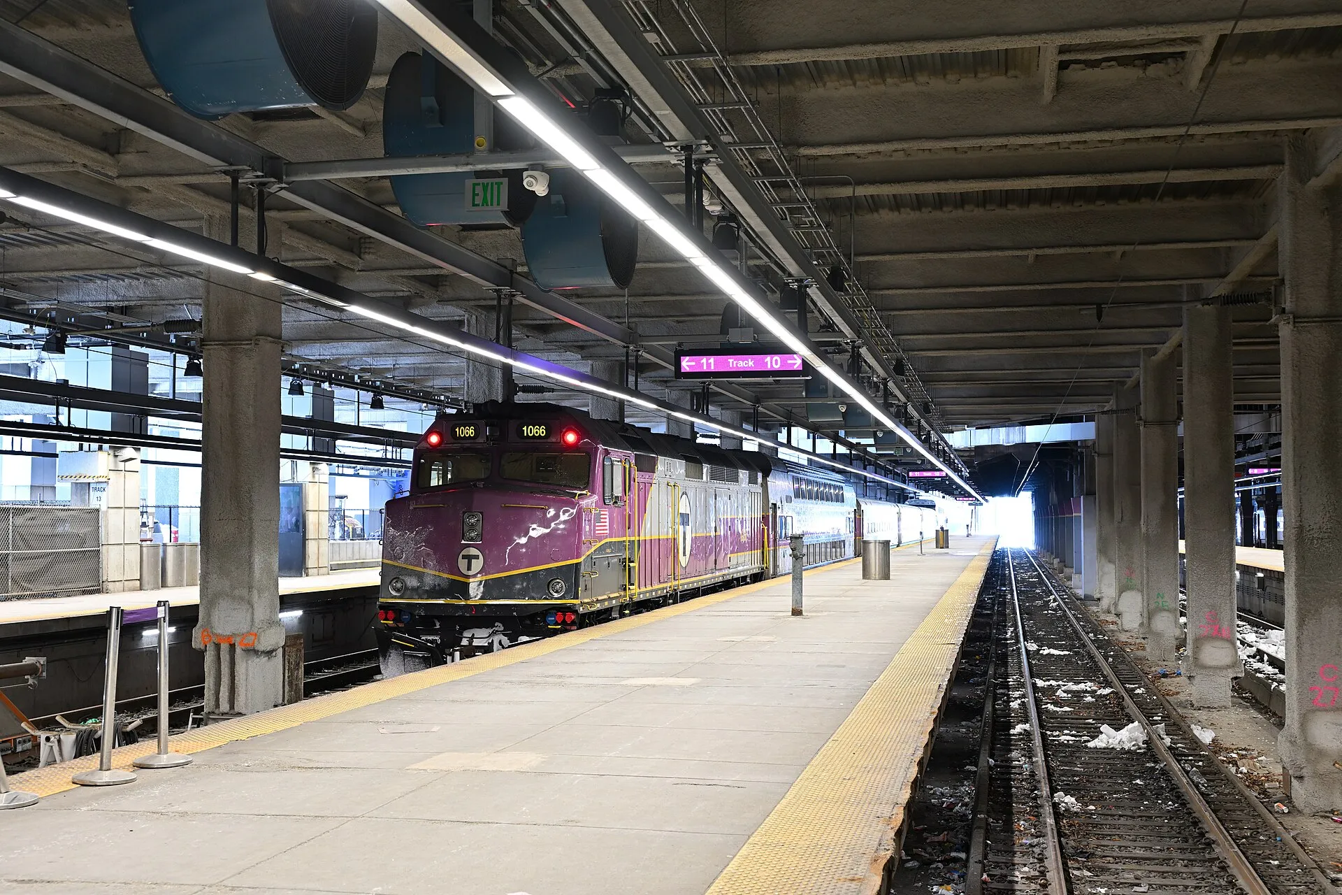 A commuter train waiting at a station platform