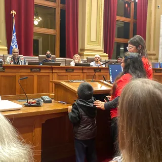 A city council chamber prepared for a public meeting