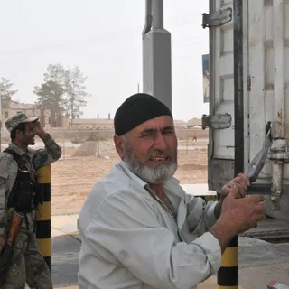 Vehicles and trucks near an international border crossing