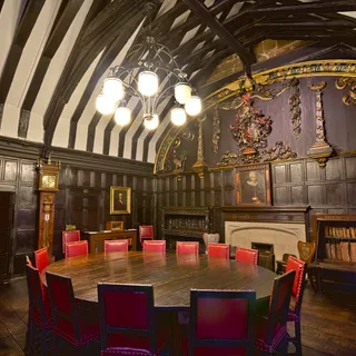 People seated in a public library reading room